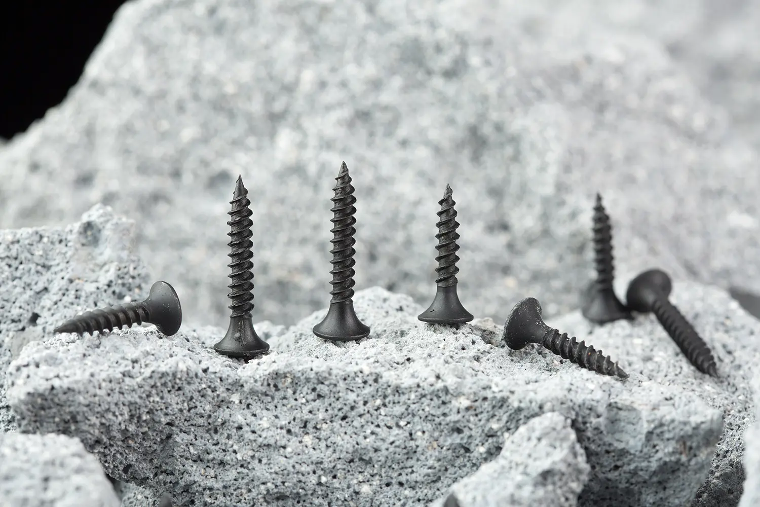 Close-up of black phosphate drywall screws